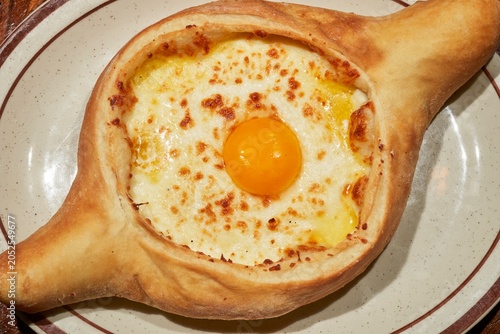 An Acharuli khachapuri, the classic bread with egg and cheeese from the Republic of Georgia as served at the Kavkaz restaurant in Loganton, Pennsylvania, USA.