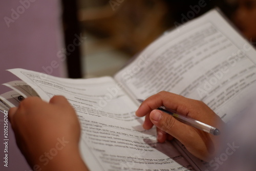 Close-up of young student reading a book