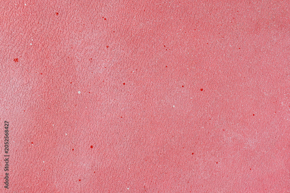 Fototapeta premium Pink textured background with fine red and white splatters