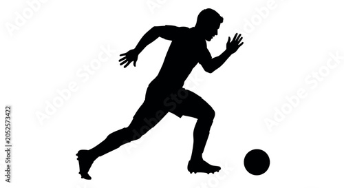 Soccer player silhouette kicking a ball