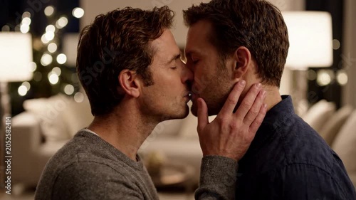 Intimate Moment Between Two Men Loving Kiss Tender Connection Emotional Bonding Warm Indoor Setting