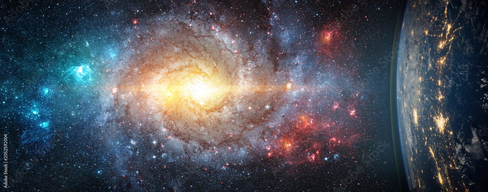 Obraz premium Spectacular deep space scene featuring a luminous spiral galaxy surrounded by billions of stars and colorful nebulae, viewed alongside Earth from orbit. . Elements of this image furnished by NASA.