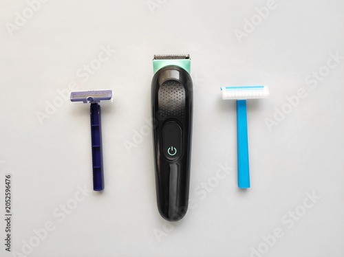 Electric trimmer and disposable razors for body grooming and hair removal. Modern shaving tools for personal care and hygiene.