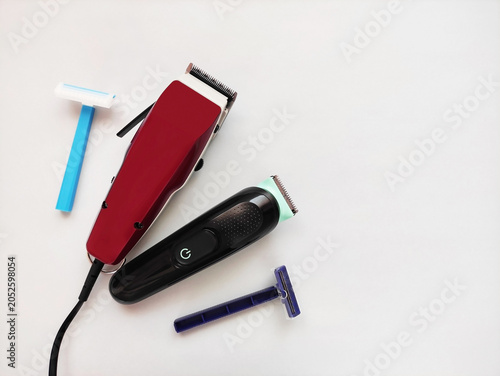 Electric trimmer and disposable razors for body grooming and hair removal. Modern shaving tools for personal care and hygiene.