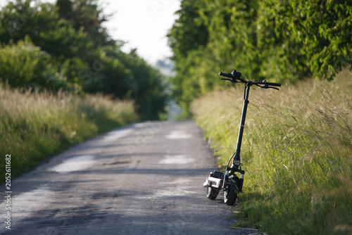 Electric scooter Kukirin in the summer on the way
