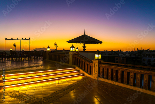 A magical sunrise over the sea with Egyptian resort hotels lining the coast.