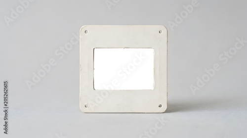 Blank Vintage 35mm Film Slide Mount Mockup on Gray Background - Retro Photography Frame for Analog Media Presentation and Nostalgic Design Elements