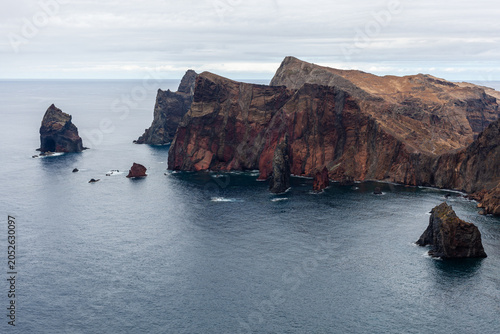 Rocky cliffs of Ponta de Sao Lourenco overlooking the Atlantic Ocean. View from Miradouro da Ponta do Rosto on Madeira Island, Portugal. Dramatic coastline with rock formations and scenic landscape.
