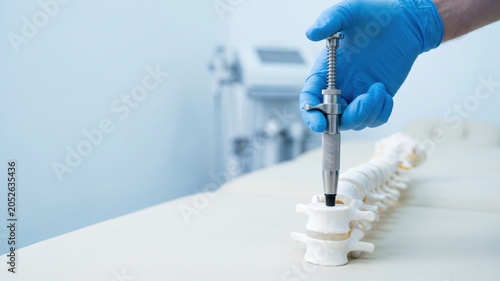 Chiropractic Instrument for Spine Adjustment with Activator in Therapeutic Setting
