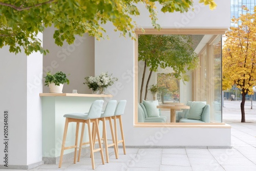 coffee shop exterior with light wood accents, white walls, and a mint green countertop, bar stools beside it