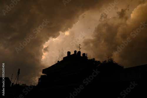 Stormy sky over buildings along via Piero della Francesca in Milan, Italy