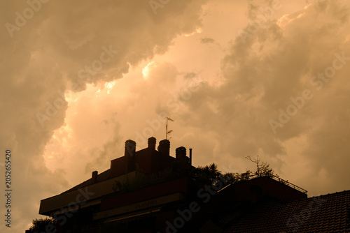 Stormy sky over buildings along via Piero della Francesca in Milan, Italy