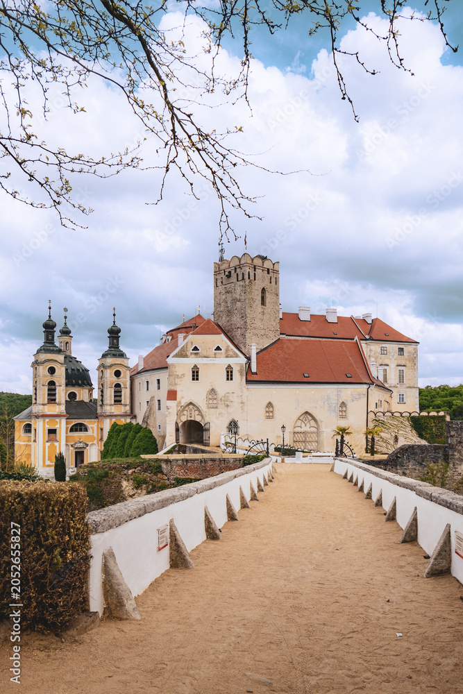 Fototapeta premium Vranov nad Dyjí Castle and Bridge Under Dramatic Cloudy Sky