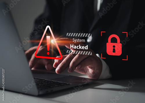 A business person checked for system vulnerabilities on their laptop. A red warning message, 