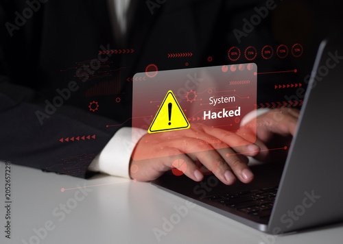 A business person checked for system vulnerabilities on their laptop. A red warning message, 