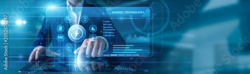 Bild auf Leinwand Energy Specialist touching the tablet using Energy Technology, displayed diagrams and graphs with icons of renewable energy, smart grids, clean power systems across the world map