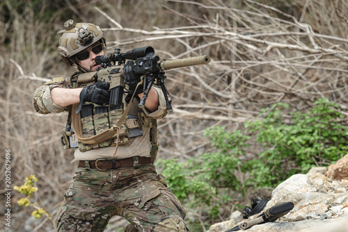 Canvastavla Military sniper aiming precision rifle during tactical reconnaissance mission in