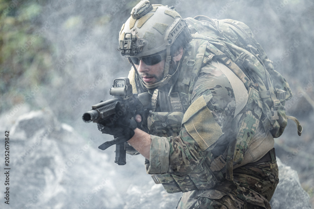 Fototapeta premium US Marine, Military Special forces soldier under heavy enemy fire intense battlefield engagement