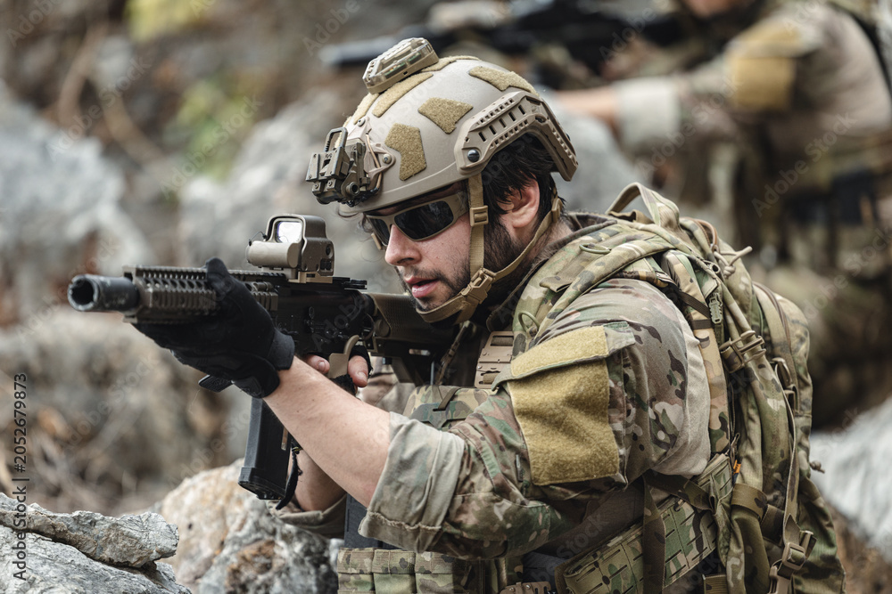 Fototapeta premium US Marine, Military Special forces soldier under heavy enemy fire intense battlefield engagement