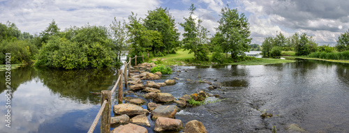 Pedestrian crossing of the Molenplas protected area near Stevensweert, part of the Maas valley river park on the Netherlands Belgium border, designed for water storage and nature restoration