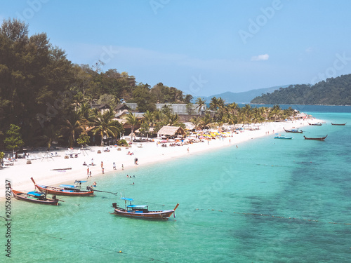 Aerial Drone View of Koh Lipe Island Beach with Turquoise Water and Longtail Boats, Thailand