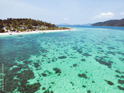 Aerial Drone View of Koh Lipe Island Beach with Turquoise Water and Longtail Boats, Thailand