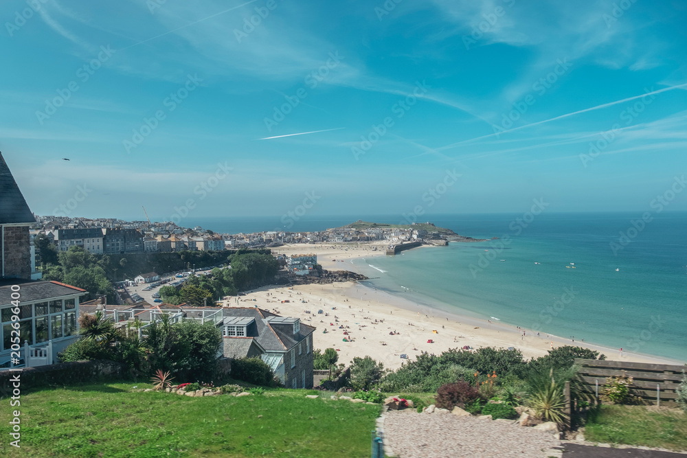 Fototapeta premium panoramic view features the scenic coastline of St Ives Bay in Cornwall, UK, Porthminster Beach