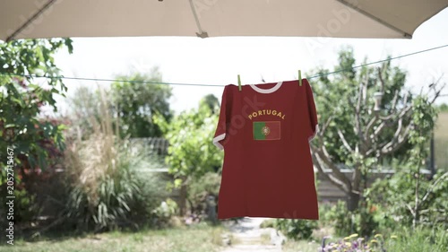 Portuguese soccer fan t-shirt hanging on clothesline
