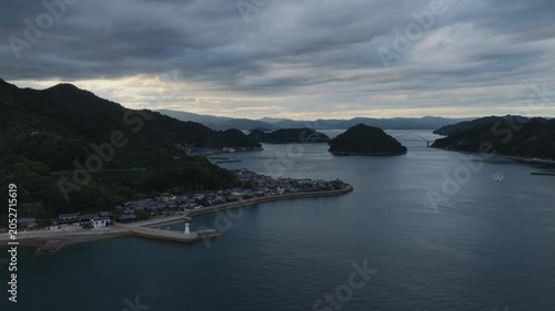 Aerial view of small coastal village in blue hour on Japanese island