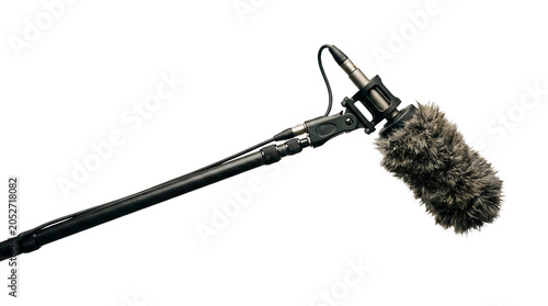 Professional shotgun microphone with a furry windscreen mounted on a boom pole isolated on transparent background