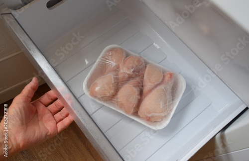 Quadro su tela Raw chicken legs in the freezer