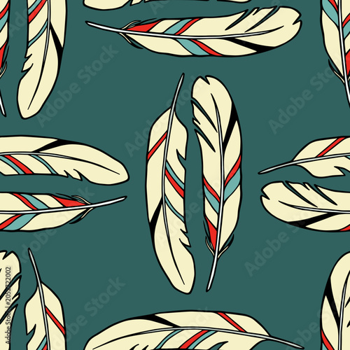 Vector seamless pattern with hand drawn bright patterned feathers. Beautiful ethnic design elements, ink drawing. Perfect for prints and patterns