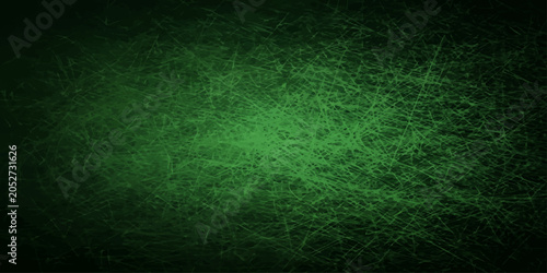 Valokuva An abstract dark green and blue grunge textured background with a vintage paper