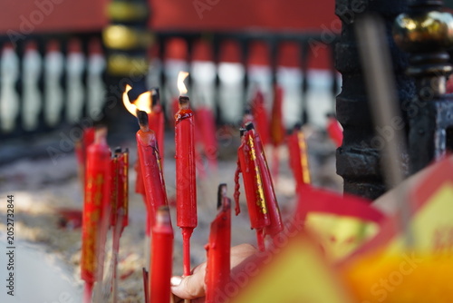 Quadro su tela Slow motion of smoke rising from incense pot at Buddhist temple.