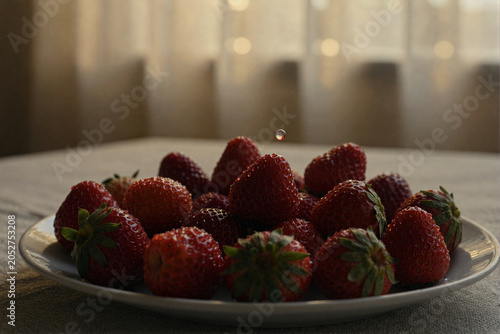 Fresh Strawberries on a Plate with Water Droplet