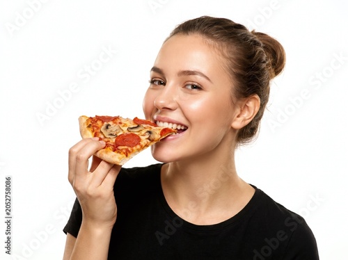 Beautiful woman eating a slice of pizza	