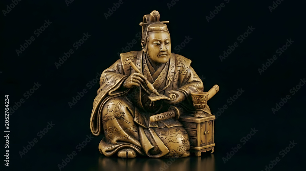 Fototapeta premium Traditional Japanese figure of man in samurai attire holding scroll 