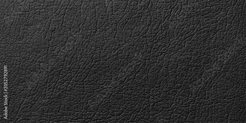 Fotografie Black leather texture, a close-up view revealing the intricate grain and natural imperfections of the material