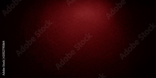 Photos A moody, dark red textured background illuminated by a single spotlight from above, creating a dramatic and intense atmosphere