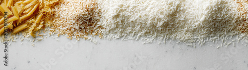 Food waste background rice pasta pile texture ingredient contrast top view kitchen marble surface concept
