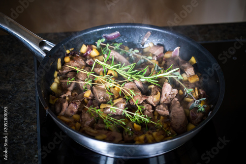 Schilderij op canvas fresh cooking at home after the hunt, roasted innards from a reddeer yearling wi