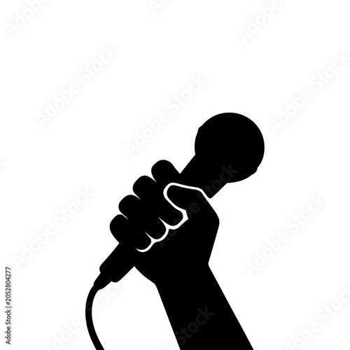 Hand holding dynamic microphone black silhouette isolated on transparent background