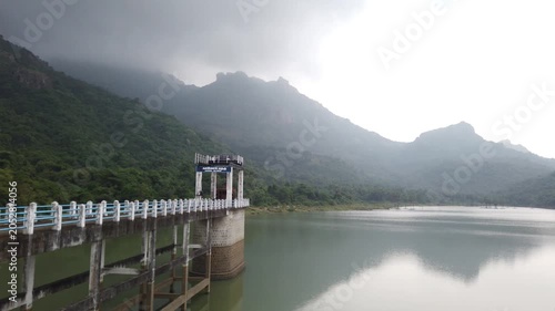 Scenic Canal Sluice Reservoir Amid Mountains and Greenery