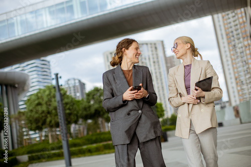 Women share ideas while wal...