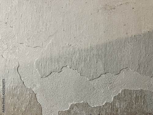 White peeling plaster wall texture with aged rough surface