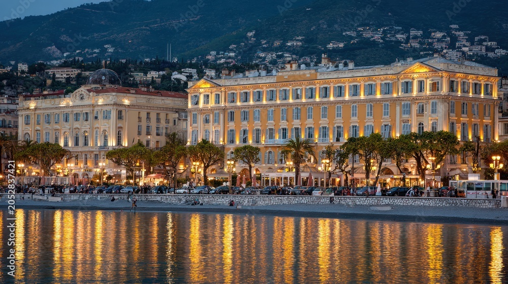 Obraz premium Illuminated Promenade des Anglais and Mediterranean Sea at Dusk in Nice, French Riviera.