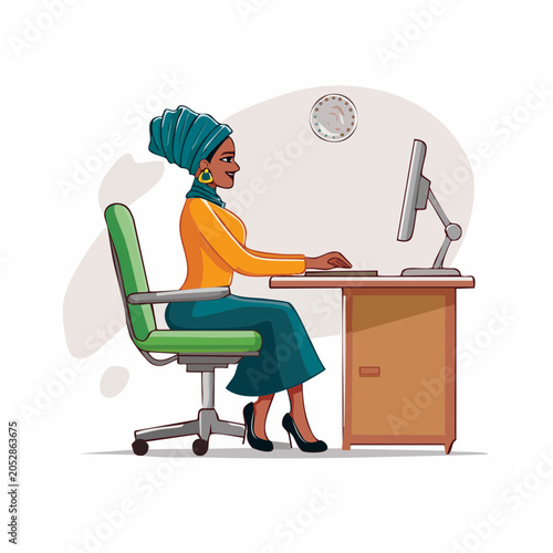 Woman in headscarf working on computer at office desk