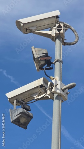 Surveillance cameras and sensors monitoring modern city street
