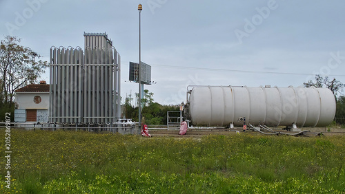 Industrial chemical plant storing fuel and supplying energy