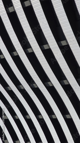 Abstract building facade featuring curved stripes pattern